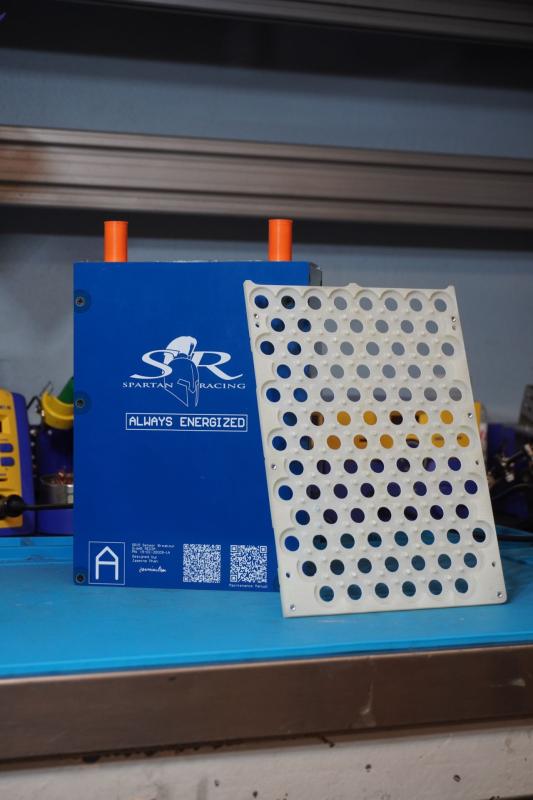Formula SAE battery module and perforated cover plate